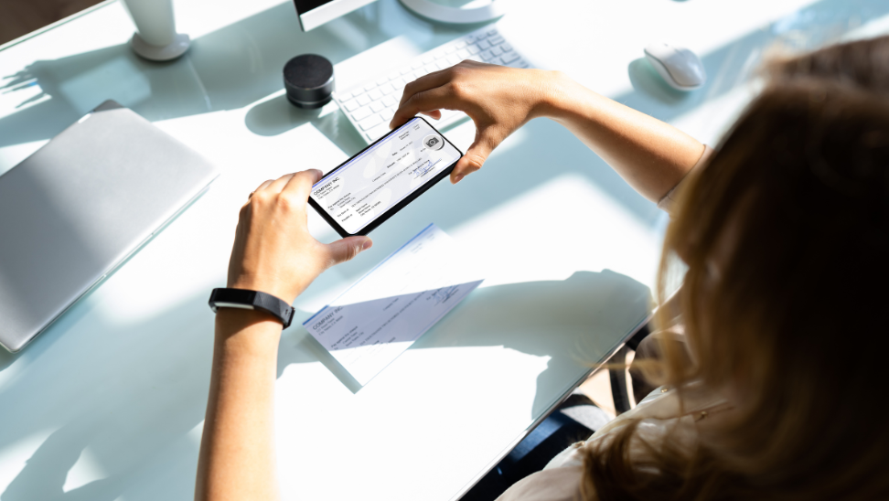 woman scanning a check